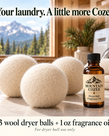 Mountain Cozee laundry kit with three ivory wool dryer balls and one 1 oz dryer ball fragrance oil bottle in a mountain cabin laundry room.
